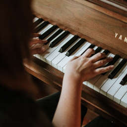 Hands playing piano